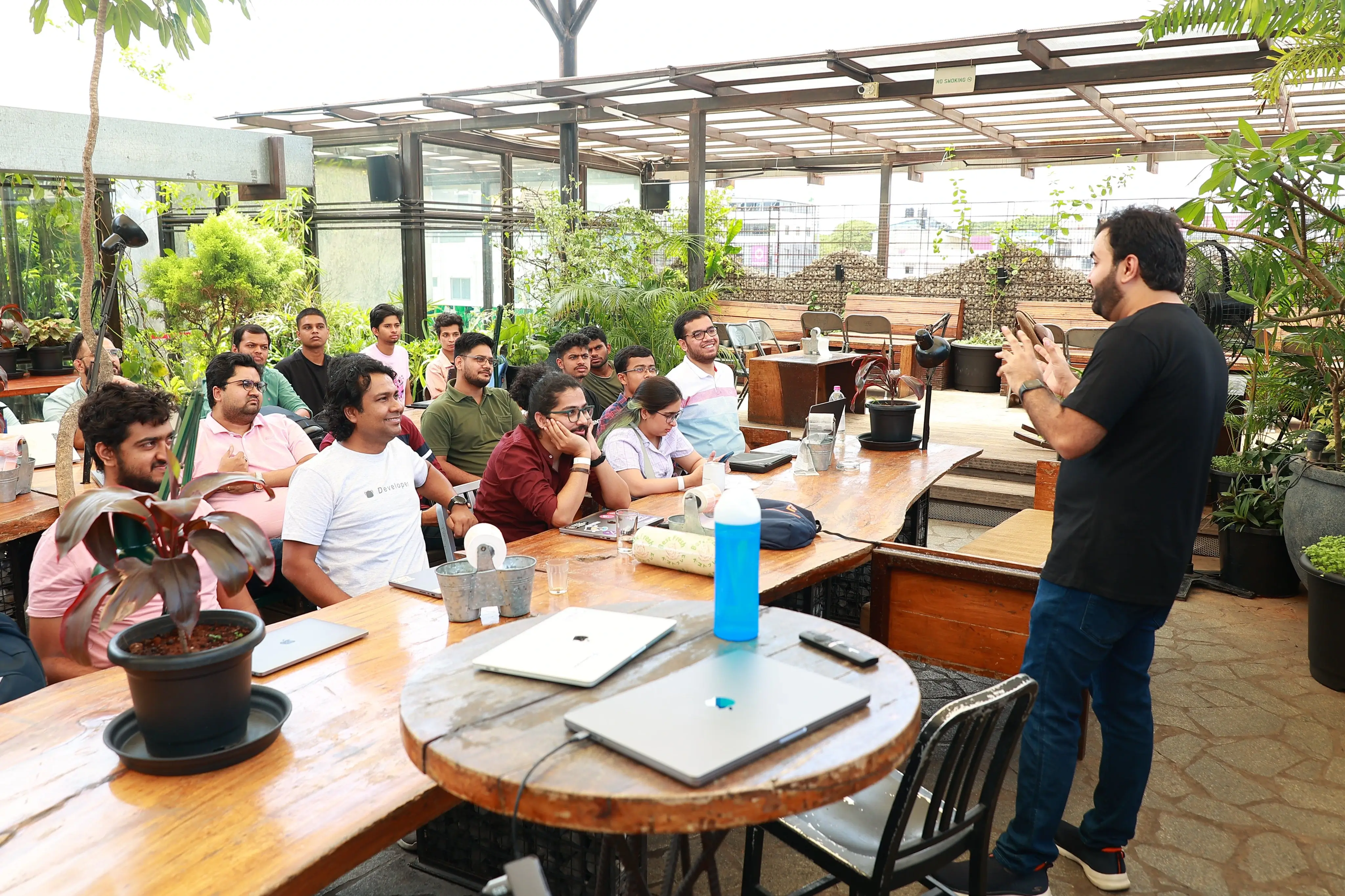 Rajat speaking at an outdoor developer meetup